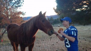 Erin feeding Sergio donuts
