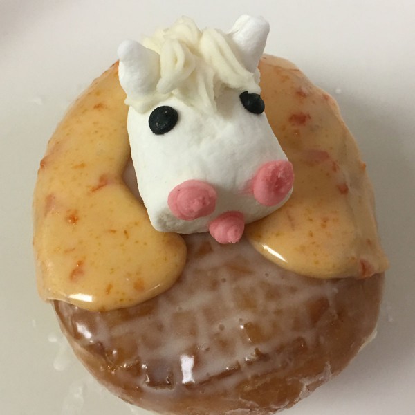 Horse-in-Shoe-donut.-It-is-a-raised-donut-filled-with-jelly-with-a-decorated-horseshoe-and-decorated-marshmallow-horse-head-on-top