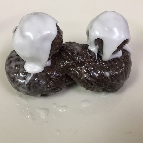 Twin-Peaks-donut.-It-is-a-chocolate-glazed-crueller-topped-with-two-stall-balls-and-extra-icing